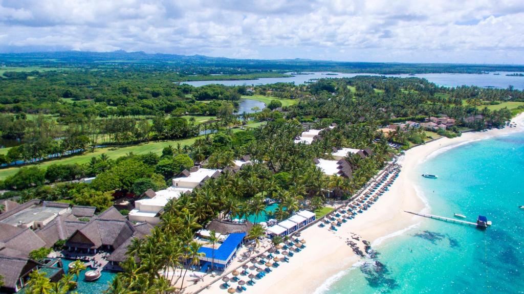 Mauritius East Coast - Belle Mare Beach, aerial view featuring the blue sea and picturesque coastline.