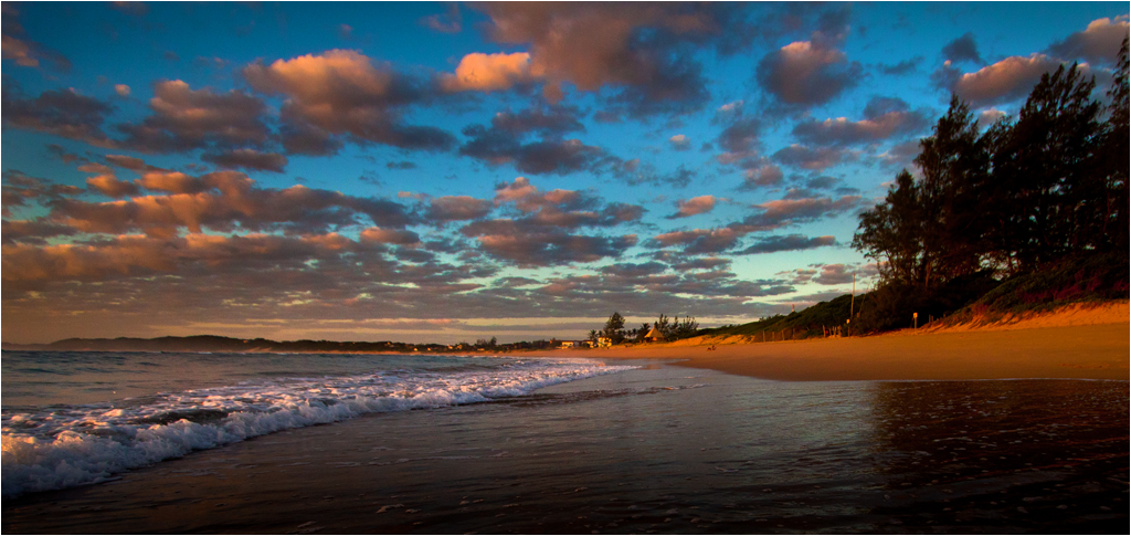 Ponta do Ouro beach in Mozambique with crystal-clear blue sea, showcasing the stunning coastline and natural beauty of the destination.