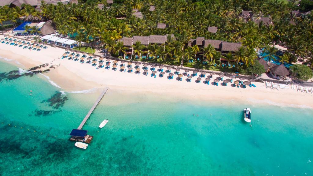 Mauritius East Coast - Aerial view of Belle Mare Beach showcasing crystal-clear waters and stunning coastal scenery.