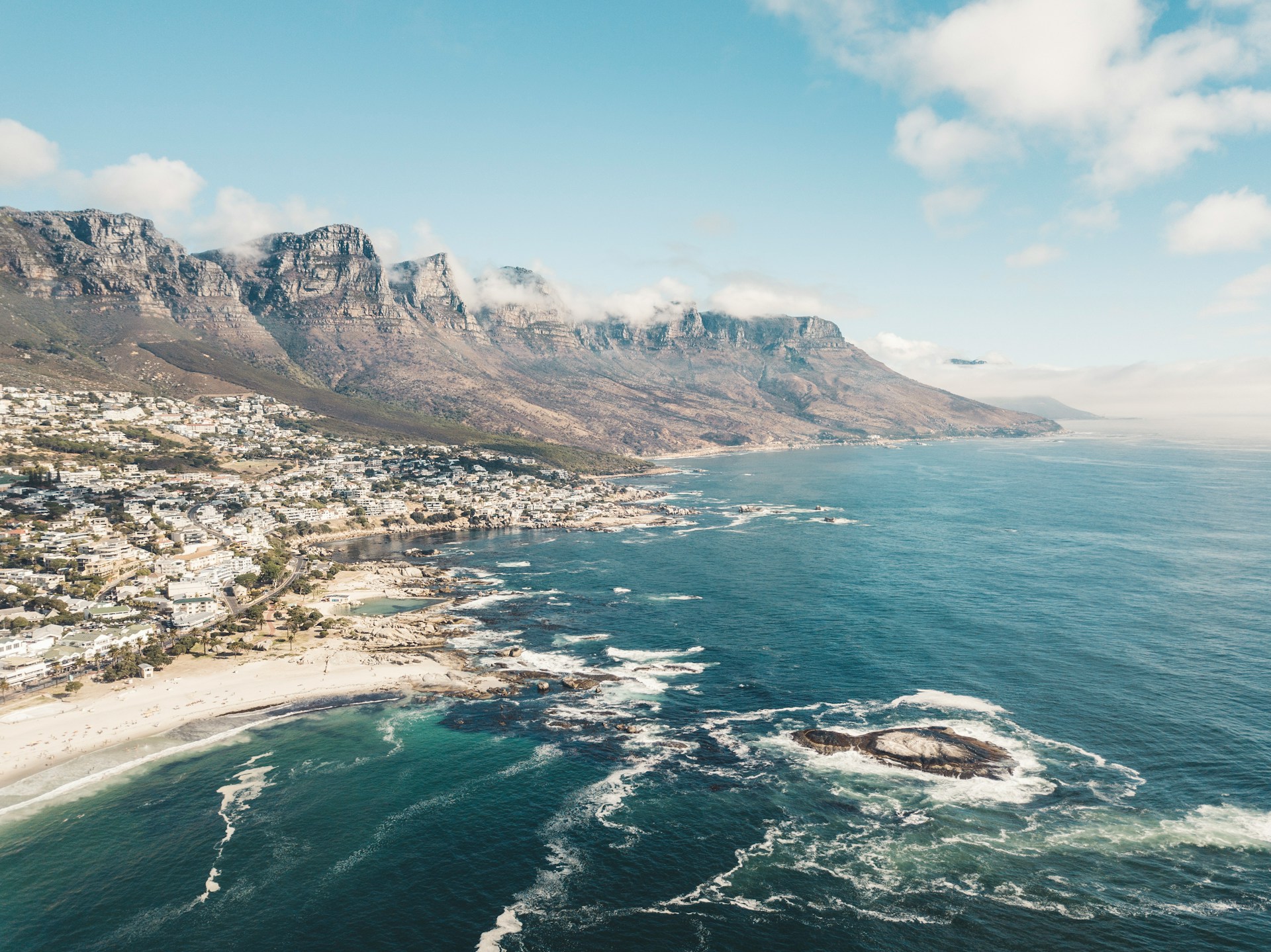 South Africa, Cape Town: A stunning airview showcasing the majestic mountains and the sparkling sea in a single breathtaking frame.