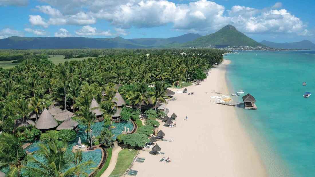 Mauritius East Coast - Belle Mare Beach, aerial view featuring the blue sea and picturesque coastline.