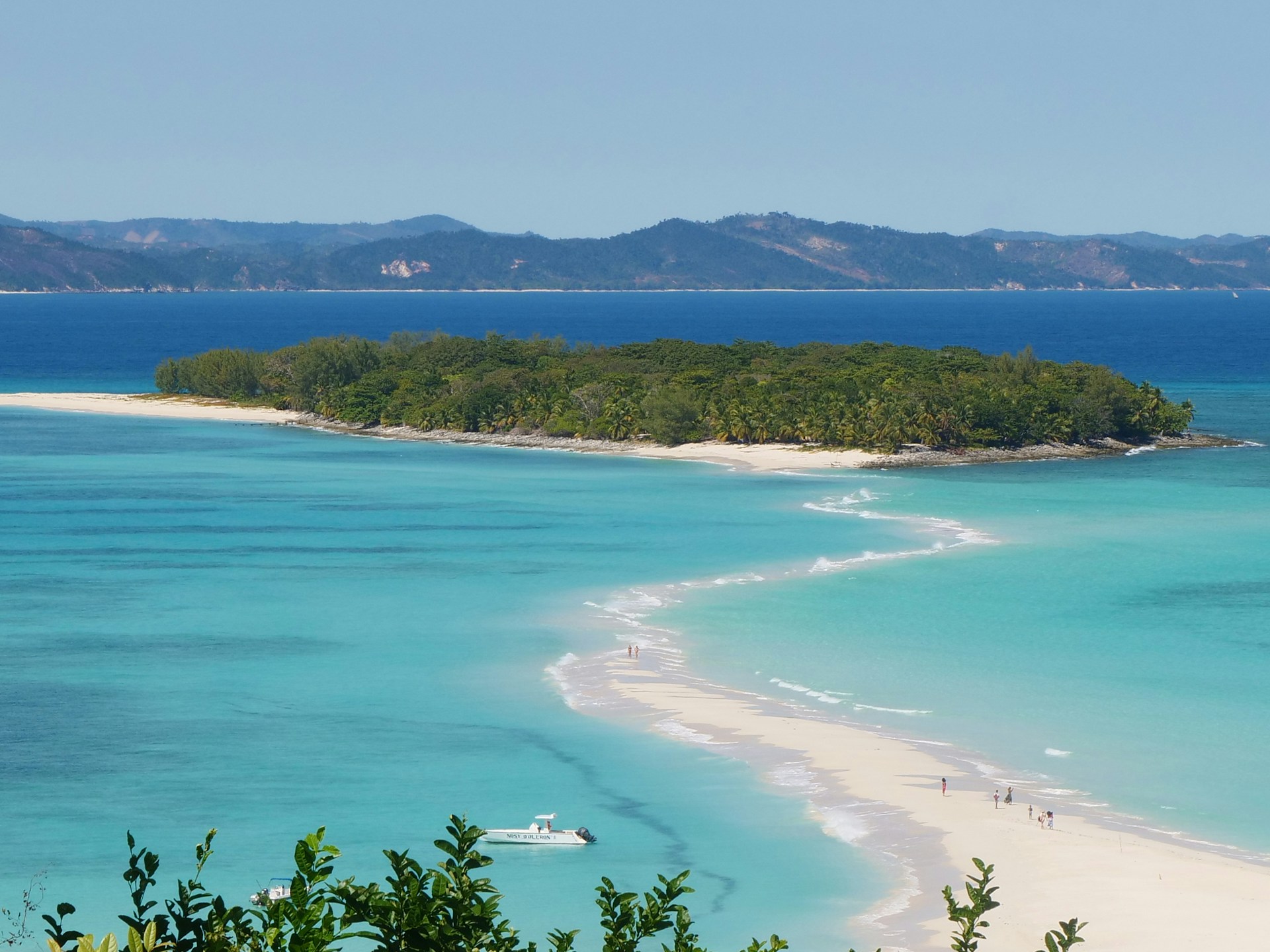 Madagascar: A breathtaking view of a tranquil island surrounded by crystal-clear waters, showcasing the natural beauty and serene landscapes of this unique destination.