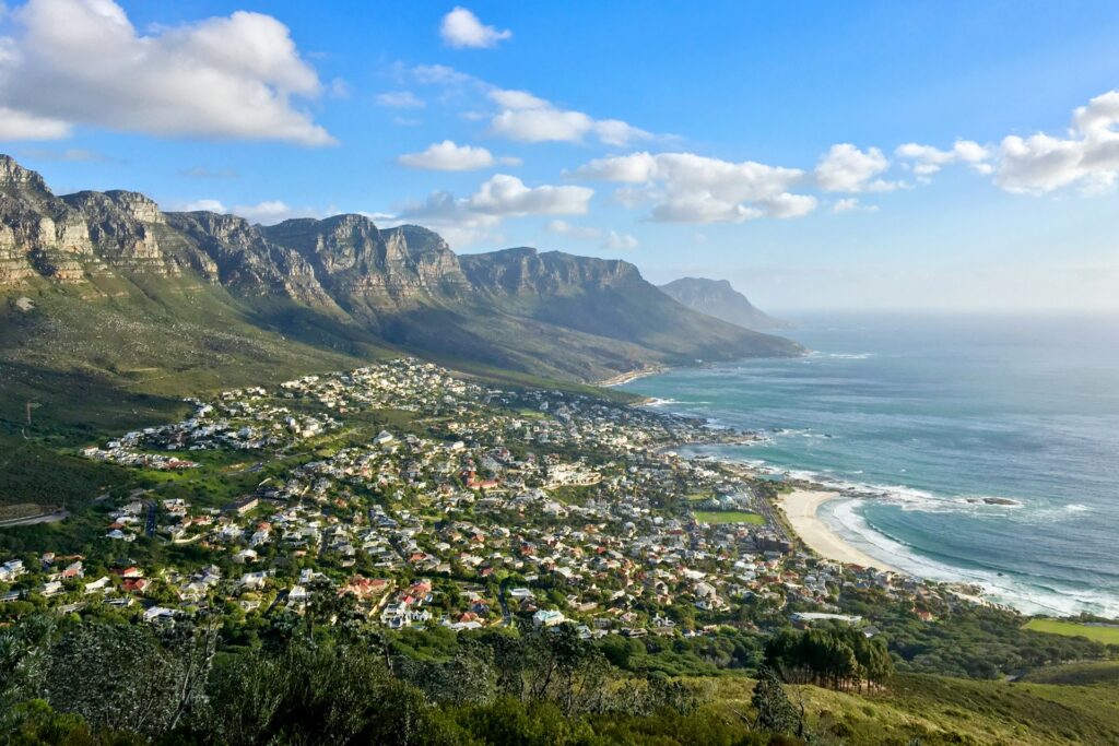 Cape Town, South Africa: Stunning aerial view of Lion's Head mountain surrounded by the sparkling sea, showcasing the iconic landscape of the region.