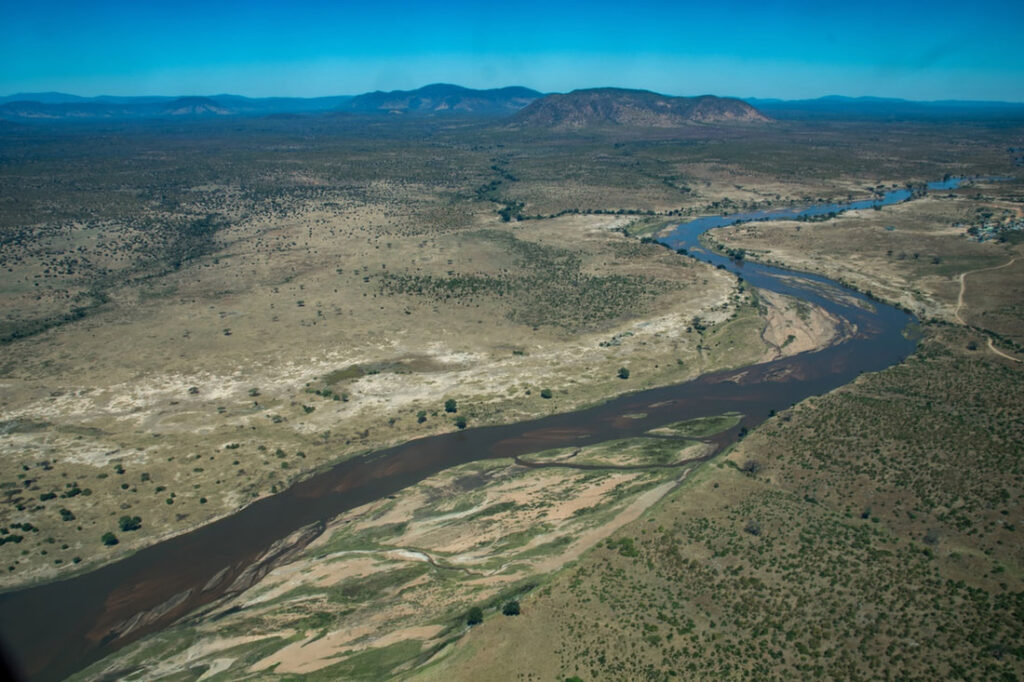 Ruaha National Park, Tanzania – aerial view of the vast and stunning landscape, highlighting the park's diverse terrain and abundant wildlife.